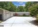 Traditional-style home with an expansive driveway, 3 car garage, red front door, and well-maintained landscaping at 750 Crest Valley Nw Dr, Sandy Springs, GA 30327