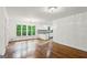 Living room featuring hardwood floors and an adjacent kitchen area at 750 Crest Valley Nw Dr, Sandy Springs, GA 30327