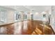 Large living room featuring hardwood floors, recessed lighting, fireplace, neutral paint, and arched windows with views to outside at 750 Crest Valley Nw Dr, Sandy Springs, GA 30327