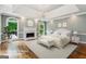 Bright, virtually staged main bedroom with tray ceiling and fireplace at 750 Crest Valley Nw Dr, Sandy Springs, GA 30327