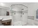 Glass enclosed shower with white subway tiles and black accent border at 750 Crest Valley Nw Dr, Sandy Springs, GA 30327