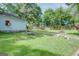 A spacious backyard featuring mature trees, and green grass at 4236 Florida Nw Ave, Atlanta, GA 30360