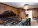 A primary bedroom features paneled walls and a large decorative bed at 4236 Florida Nw Ave, Atlanta, GA 30360