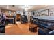 Comfortable living room with a brick fireplace, wood floors, and a dark leather sofa set at 4236 Florida Nw Ave, Atlanta, GA 30360