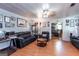 Comfortable living room with wooden floors, dark sofas, and decorative wall hangings at 4236 Florida Nw Ave, Atlanta, GA 30360