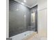 Modern bathroom featuring a glass-enclosed shower with gray herringbone tile at 103 Maddox Rd, Buford, GA 30518