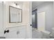 Contemporary bath with gray tiled shower, white vanity, and modern fixtures at 103 Maddox Rd, Buford, GA 30518