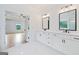 Bright bathroom with double vanity and black hardware open to bedroom at 103 Maddox Rd, Buford, GA 30518