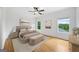 Serene bedroom with hardwood floors, natural light, and picturesque views at 103 Maddox Rd, Buford, GA 30518