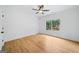 Bright bedroom with a ceiling fan, hardwood flooring and ample natural light at 103 Maddox Rd, Buford, GA 30518