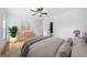 Inviting bedroom with hardwood floors, neutral tones, and ensuite bathroom at 103 Maddox Rd, Buford, GA 30518