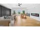 Large, well-lit bonus room with pool table, foosball, fireplace, and hardwood floors at 103 Maddox Rd, Buford, GA 30518