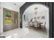 Elegant dining room featuring modern lighting, neutral decor, and views of the backyard at 103 Maddox Rd, Buford, GA 30518