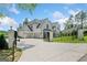 Spacious home featuring a gated driveway and a three-car garage with ample parking at 103 Maddox Rd, Buford, GA 30518