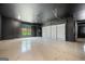 Spacious garage with sleek flooring and ample room for multiple vehicles and storage at 103 Maddox Rd, Buford, GA 30518
