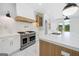 Bright kitchen features marble countertops, stainless steel appliances, and a center island with a gold faucet at 103 Maddox Rd, Buford, GA 30518