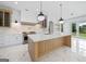 Gourmet kitchen with marble countertops, a large island, stainless steel appliances, and pendant lighting at 103 Maddox Rd, Buford, GA 30518