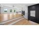 Spacious living area with light-colored hardwood floors and a staircase at 103 Maddox Rd, Buford, GA 30518