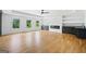 Expansive living room with hardwood floors, built-in shelving, fireplace and natural light at 103 Maddox Rd, Buford, GA 30518