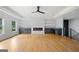 Bright living room showcasing hardwood floors, fireplace, and built-in shelving at 103 Maddox Rd, Buford, GA 30518
