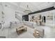 Bright, open-concept living room with marble floors, coffered ceiling, and seamless access to the kitchen at 103 Maddox Rd, Buford, GA 30518