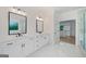 Bright bathroom featuring double sinks, marble floors, and a glass enclosed shower at 103 Maddox Rd, Buford, GA 30518