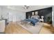 The main bedroom features a dark accent wall and en-suite bathroom at 103 Maddox Rd, Buford, GA 30518