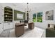 Comfortable home office with custom shelving, large window, and contemporary decor at 103 Maddox Rd, Buford, GA 30518
