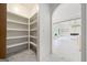 Walk-in pantry with custom shelving providing ample storage space at 103 Maddox Rd, Buford, GA 30518