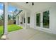 Covered outdoor patio with brick accents, ceiling fan, and view of the backyard at 103 Maddox Rd, Buford, GA 30518