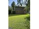 Large backyard with lush green lawn, perfect for relaxation or entertaining, also features chain link fence at 90 Cabriolet Trail, Mcdonough, GA 30253