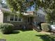 Traditional two-story brick home with a covered front porch, landscaped yard, and a charming curb appeal at 90 Cabriolet Trail, Mcdonough, GA 30253