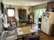 Spacious eat-in kitchen features wood floors, classic cabinets and sliding doors to the outdoors at 90 Cabriolet Trail, Mcdonough, GA 30253