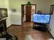 Inviting living room with ample natural light, tv, and comfortable seating for relaxing or entertaining guests at 90 Cabriolet Trail, Mcdonough, GA 30253