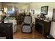 Cozy living room featuring comfortable seating, a decorative fireplace, and a wall mirror for added space at 90 Cabriolet Trail, Mcdonough, GA 30253