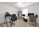 Spacious bedroom featuring a white desk, shelving, and a comfortable chair for a bright and functional workspace at 1335 Vine Cir, Mcdonough, GA 30253