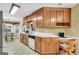 Bright kitchen featuring oak cabinets, a dishwasher, and a dining area at 1335 Vine Cir, Mcdonough, GA 30253