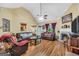 Spacious living room featuring a fireplace, vaulted ceilings, and hardwood floors at 1335 Vine Cir, Mcdonough, GA 30253