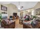 Comfortable living room with a fireplace, ceiling fan, and ample seating at 1335 Vine Cir, Mcdonough, GA 30253
