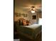 Bedroom features stylish decor, including a patterned headboard, modern wall art, and soft window treatments at 565 Scarborough Rd, Ellenwood, GA 30294