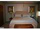 Well-lit bedroom featuring a neutral color scheme and decorative wall art at 565 Scarborough Rd, Ellenwood, GA 30294