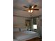 Bedroom features a ceiling fan and neutral color scheme at 565 Scarborough Rd, Ellenwood, GA 30294
