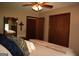 Bedroom with closets, warm tones, and stylish bedding offers a cozy and inviting personal space at 565 Scarborough Rd, Ellenwood, GA 30294
