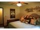 Comfortable bedroom with plush bedding, decorative pillows, and a mirrored dresser, creating a serene retreat at 565 Scarborough Rd, Ellenwood, GA 30294