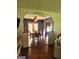 Inviting dining area with hardwood floors, French doors to deck, ceiling fan, and view from living room at 565 Scarborough Rd, Ellenwood, GA 30294