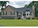 Charming single-Gathering home with a well-maintained front yard, inviting curb appeal, and bay window at 565 Scarborough Rd, Ellenwood, GA 30294