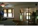Bright living room featuring bay windows, neutral paint, ceiling fan, and staircase to upstairs at 565 Scarborough Rd, Ellenwood, GA 30294