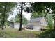 Large lot with detached two car garage and metal carport on this spacious two-story home's rear exterior at 565 Scarborough Rd, Ellenwood, GA 30294