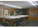 Large workroom with ample counter space, cabinets, and natural light, perfect for hobbies or home business at 565 Scarborough Rd, Ellenwood, GA 30294