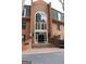 Stately brick condo building featuring an impressive arched window and doorway design at 24317 Plantation Ne Dr, Atlanta, GA 30324